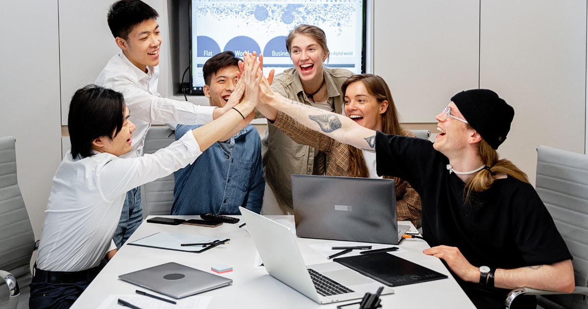 A team of employees celebrating something together